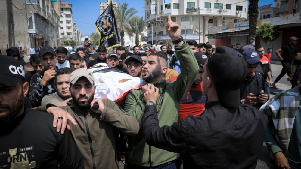 Mourners bid farewell to Palestinian-Russian doctor Jamal Khaswan and his son as their bodies are transported from the mortuary to their homes ahead of their burial in Gaza City on May 9, 2023, following early morning Israeli air strikes on the Palestinian territory. The air raids killed three Islamic Jihad militant group leaders and several others, according to officials in the Hamas-controlled territory. Photo by Atia Mohammed/Flash90