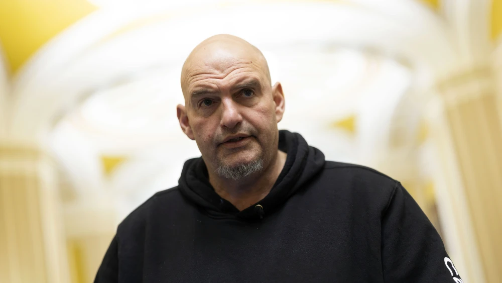 U.S. Sen. John Fetterman (D-Pa.) speaks to reporters as he leaves the Senate Chamber at the U.S. Capitol on January 29, 2026 in Washington, DC. Photo by Kevin Dietsch/Getty Images.