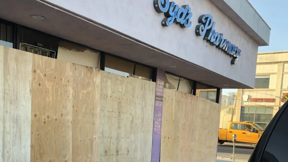 The boarded-up exterior of Syd's Pharmacy in Los Angeles, vandalized on May 30, 2020, during nationwide protests that followed in the wake of the death of African-American George Floyd in police custody in Minneapolis on May 25. Credit: Courtesy.