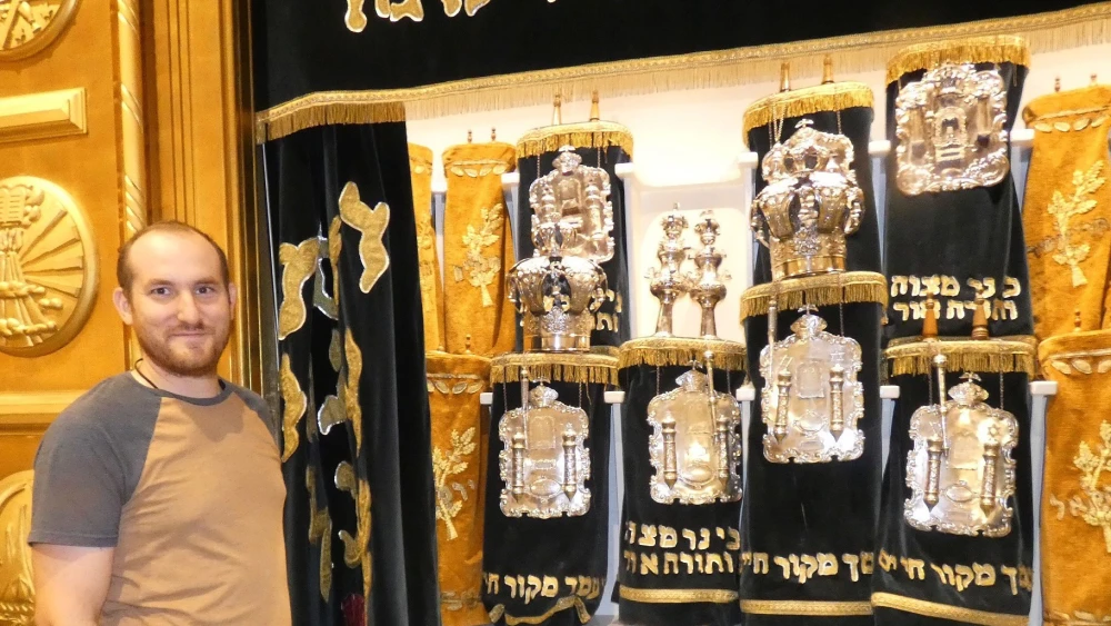 Rabbi Adam Berman of Congregation B’nai Jacob in Charleston, W.Va., shows a missing slot for the Torah loaned to the National Jamboree, sponsored by the National Jewish Committee on Scouting, which took place in Glen Jean, W.Va., from July 22 to July 31, 2026. Photo by Alan Smason.
