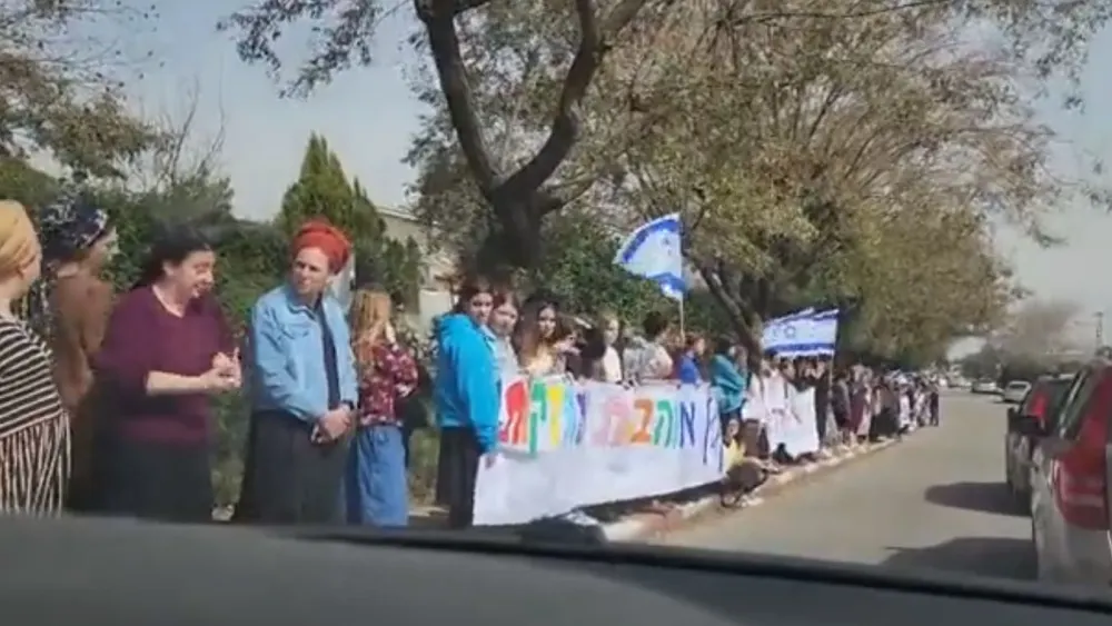 People stood on the side of the road as the funeral procession passed, Feb. 27, 2023. Credit: Twitter