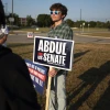 A young supporter of Dr. Abdul El-Sayed, a Democratic candidate for Michigan's open U.S. Senate seat, stands outside a polling precinct as voters cast their ballots in the Michigan Primary election in Lansing on Aug. 4, 2026. Photo by Bill Pugliano/Getty Images.