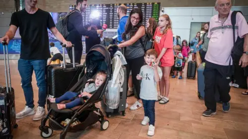 Israelis who were on the plane that landed in Saudi Arabia are seen after their arrival at Ben-Gurion Airport, Aug. 29, 2023. Photo by Avshalom Sassoni/Flash90.