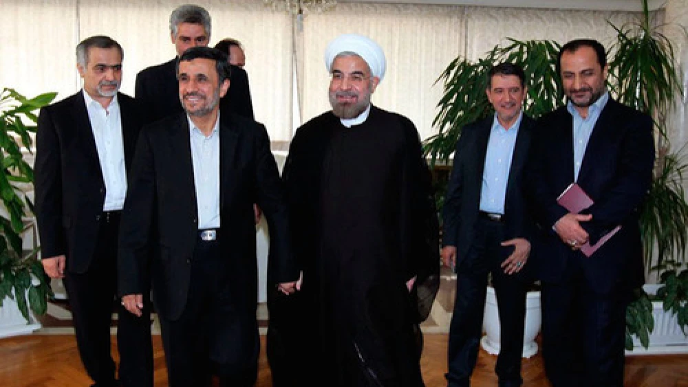 Iranian President Hassan Rouhani (center) with his predecessor, Mahmoud Ahmadinejad (second from left), in June 2013. Credit: Wikimedia Commons.