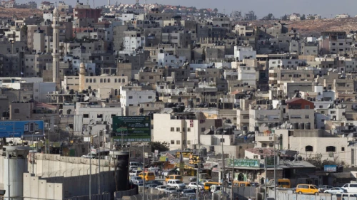 A view of the separation wall and checkpoint in the West Bank city of Kalandia, near Ramallah. Sept. 29, 2014. Photo by Miriam Alster/Flash90.