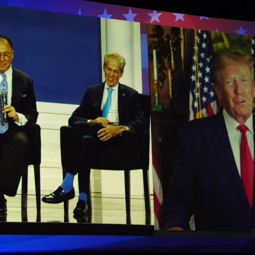 Republican Jewish Coalition CEO Matt Brooks (left) and National chairman Sen. Norm Coleman speak with former President Donald Trump, who appeared via satellite at the RJC's annual meeting, Nov. 19, 2022. Credit: Republican Jewish Coalition.