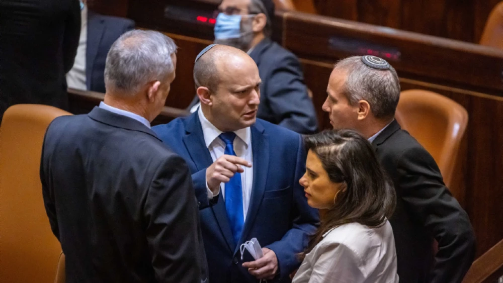 Yamina Party leader Naftali Bennett (center). Blue and White leader Benny Gantz (left), Yamina MK Ayelet Shaked (bottom right) and Blue and White MK Yehiel Moshe "Hili" Tropper in the Knesset plenum hall, June 2, 2021. Photo by Olivier Fitoussi/Flash90.