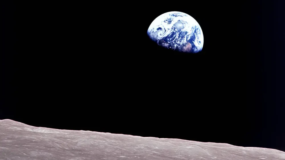 Taken aboard Apollo 8 by Bill Anders, this iconic picture shows the planet Earth peeking out from beyond the lunar surface as the first crewed spacecraft circumnavigated the moon, with astronauts Anders, Frank Borman and Jim Lovell aboard, Dec. 24, 1968. Credit: NASA.
