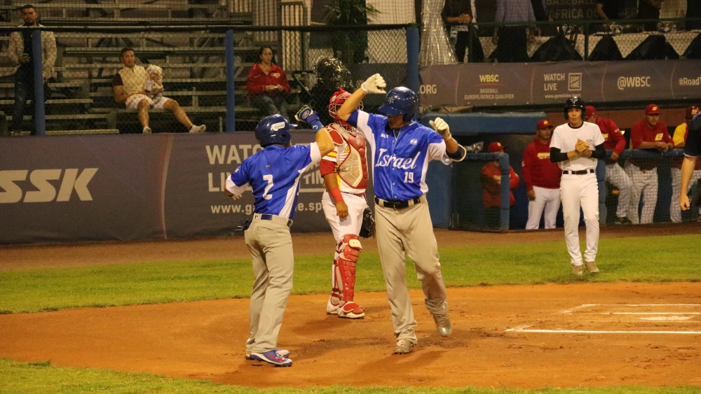 Team Israel celebrates scoring a run during a game against Spain. Photo by Margo Sugarman.