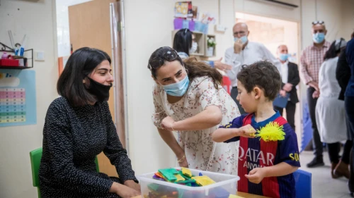 Children and teachers return to the Gan Nayot kindergarten in Jerusalem on May 10, 2020, for the first time in two months, after being hut down due to the COVID-19 pandemic. Photo by Yonatan SIndel/Flash90.