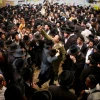 Jewish men celebrate the Jewish holiday of Lag B’Omer in the northern Israel town of Meron on May 3, 2018. Lag B’Omer commemorates the death of Rabbi Shimon bar Yochai, one of the most important sages in Jewish history, more than 1,800 years ago. Photo by David Cohen/Flash90.