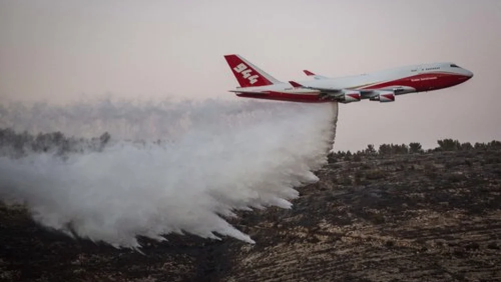 On Nov. 26, the American-dispatched Boeing 747 Supertanker plane helps extinguish a forest fire that broke out in Nataf, near Jerusalem. Credit: Hadas Parush/Flash90.