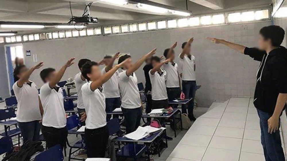 A group of 11 high school senior students in Brazil performed the Nazi salute in class. Credit: Instagram Screenshot.
