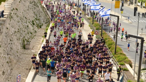 Thousands of runners take part in the 2018 international Jerusalem Marathon in Jaffa Gate in Jerusalem's Old City on March 9, 2018. Photo by Mendy Hechtman/Flash90.