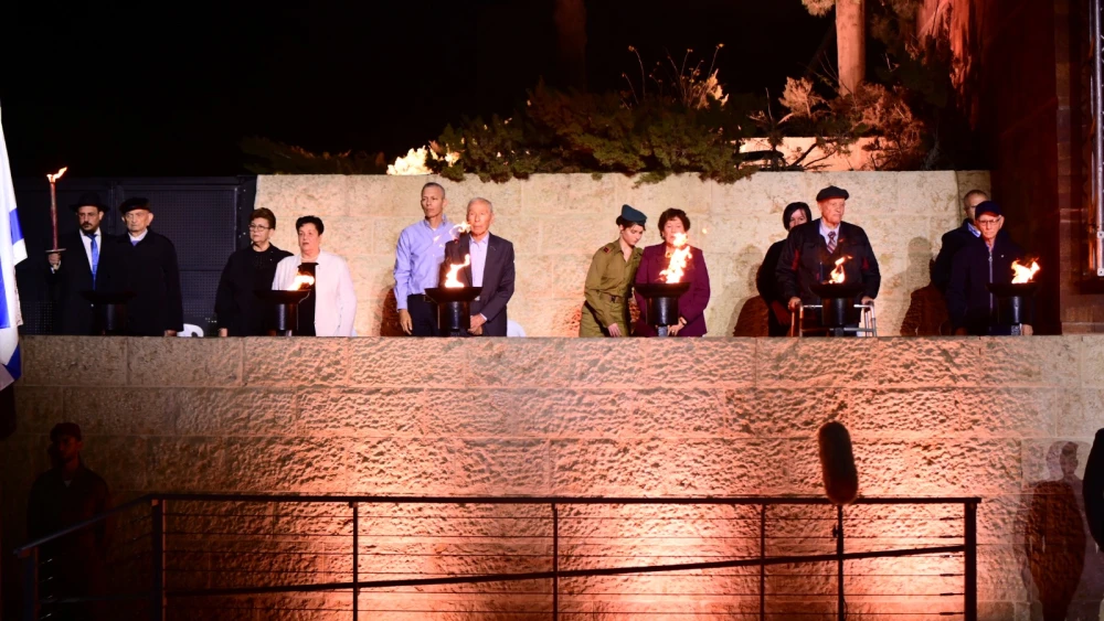 Six Holocaust survivors and family members light the memorial torches at Yad Vashem, April 13, 2026. Photo by Rafi Ben Hakoon/Yad Vashem.