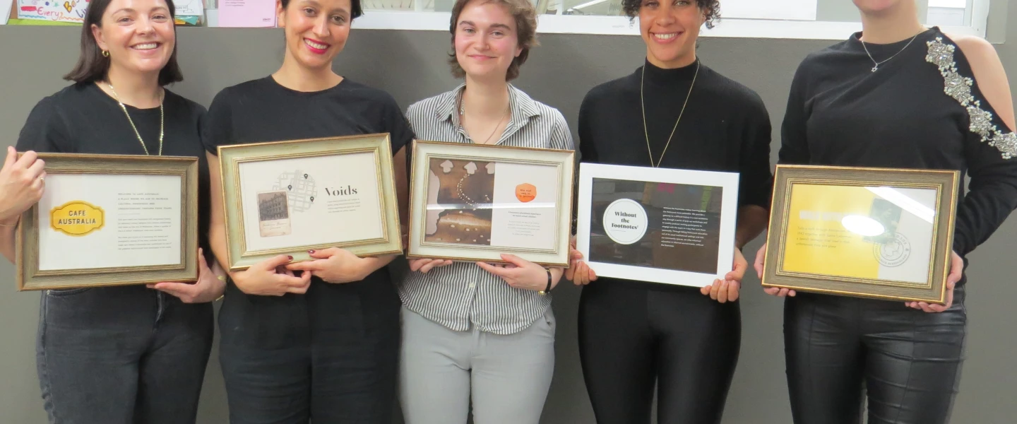 Students from the University of Haifa's Innovation Hub for Holocaust Education and Commemoration pose with plaques describing their individual projects. Credit: University of Haifa.