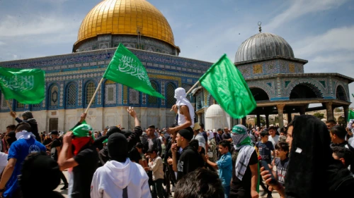 Palestinians fly Hamas flags after Ramadan prayers at the Al-Aqsa mosque on the Temple Mount in Jerusalem, April 22, 2022. Photo by Jamal Awad/Flash90.