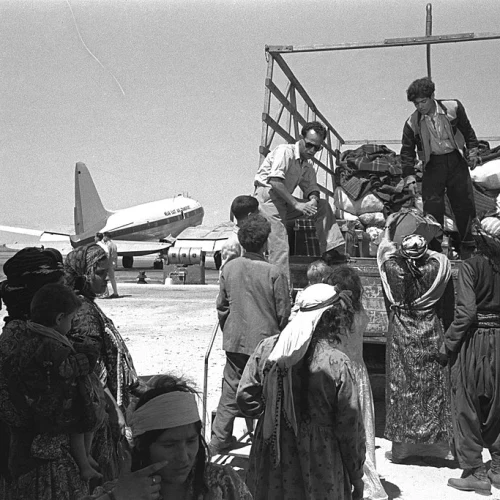 Jewish refugees from Iraq leave Lod (today Ben-Gurion) Airport, 1951. Credit: GPO via Wikimedia Commons.