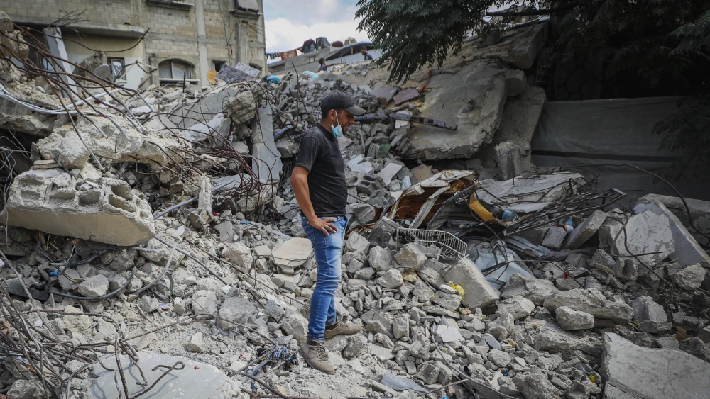 A Palestinian looks upon the rubble of a building destroyed during the Israel-Hamas war, in the Nuseirat refugee camp in the central Gaza Strip, on Sept. 28, 2026. Photo by Ali Hassan/Flash90.