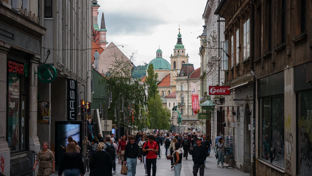 Pedestrians walk in the Copova street in Ljubljana city center, on September 26, 2025. Photo by Jure Makovec/AFP via Getty Images.