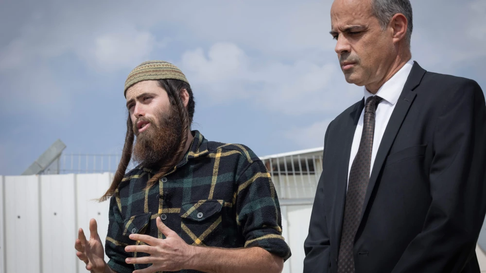 Elisha Yered (left), who was briefly detained on charges of involvement in the death of a Palestinian in Samaria, and his attorney outside the Ofer military court, Oct. 5, 2023. Photo by Chaim Goldberg/Flash90.