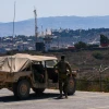 Israeli soldiers look over southern Lebanon from the Northern Israeli border, Aug. 10, 2026. Photo by Ayal Margolin/Flash90.