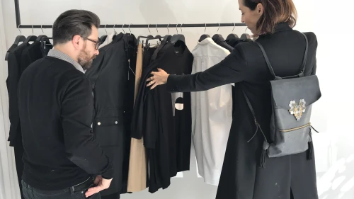 Nir Goeta and Galit Reismann look through Nir’s designs. Credit: Eliana Rudee.