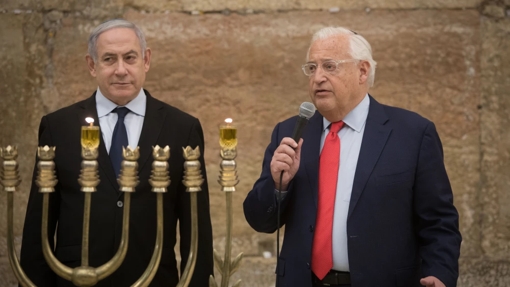 Israeli Prime Minister Benjamin Netanyahu and U.S. Ambassador to Israel David Friedman light Hanukkah candles at the Western Wall on December 22, 2019. Photo by Noam Revkin Fenton/Flash90.