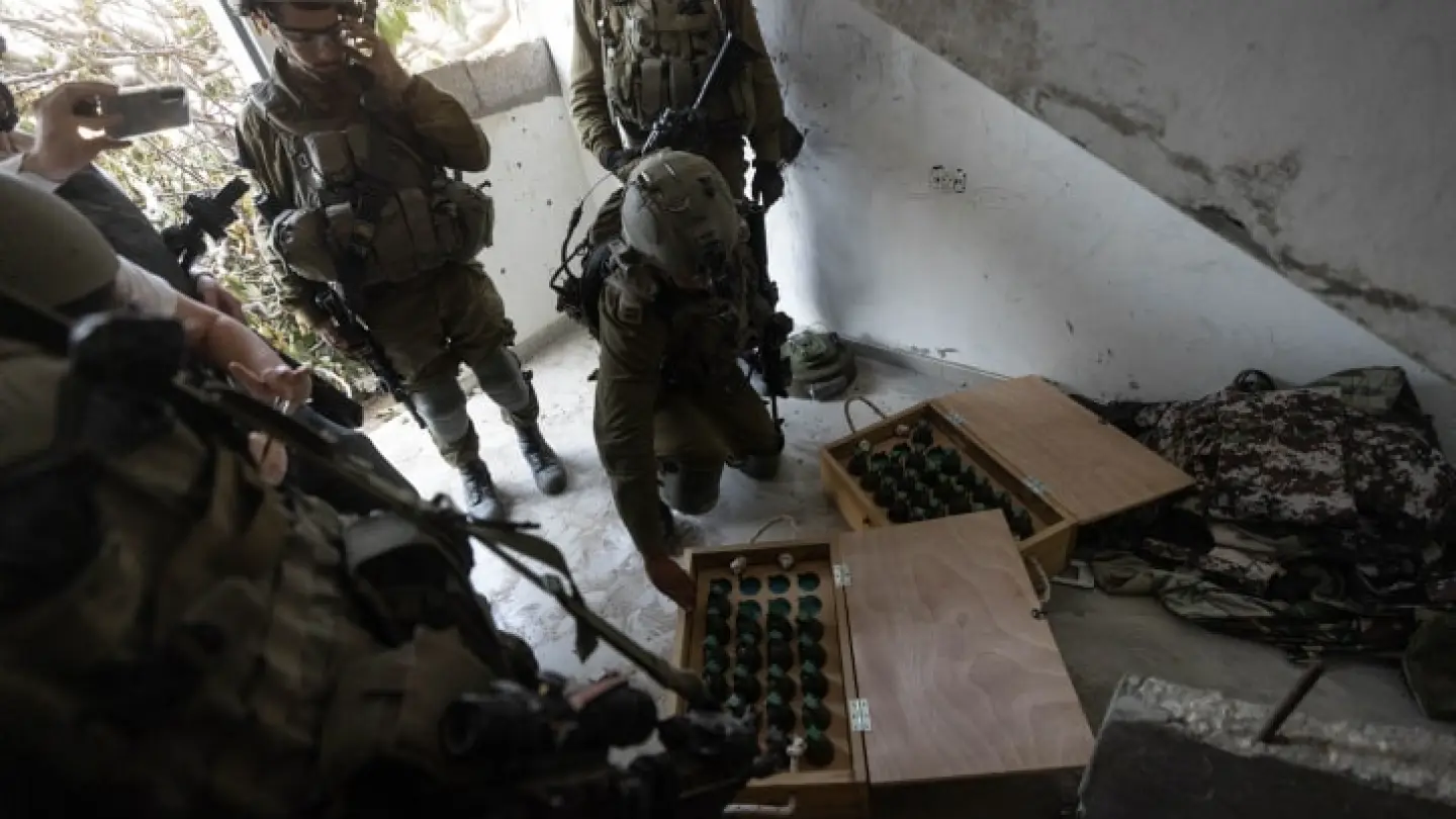 Israeli soldiers display grenades captured during a raid at the Jabalia refugee camp, in the northern Gaza Strip, Dec. 12, 2023. Photo by Chaim Goldberg/Flash90.