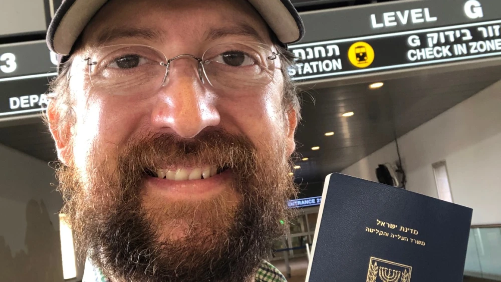 Yehoshua Zepeda showing off his new Israeli passport. Credit: Courtesy.