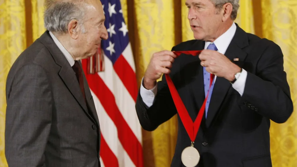 Richard (right) honored by George W. Bush with the National Humanities Medal in November 2007. Credit: Courtesy.