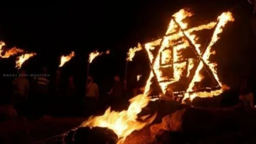 A burning swastika inside a Star of David, erected on Aug. 14, 2021 during riots in the village of Beita in Samaria. Source: Screenshot.