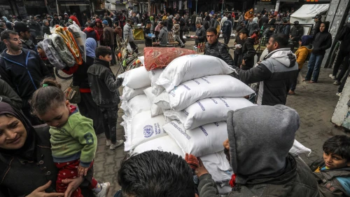 Palestinians receive food supplies at an UNRWA school in Rafah, the southern Gaza Strip, Jan. 28, 2024. Photo by Abed Rahim Khatib/Flash90.