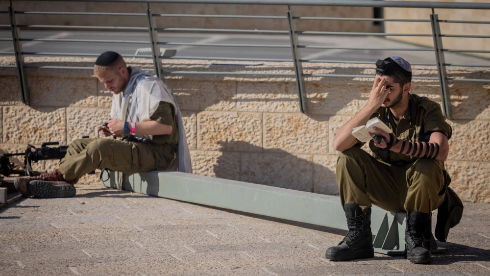 Ultra-Orthodox Jewish soldiers from the Hasmonean Brigade take part in a beret march after completing seven months of basic and advanced training, at the Western Wall in Jerusalem's Old city on Aug. 6, 2025. Photo by Chaim Goldberg/Flash90.