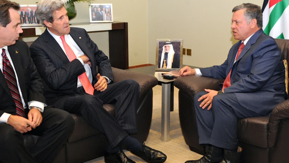 U.S. Secretary of State John Kerry, accompanied by U.S. Ambassador to Jordan Stuart E. Jones, meets with King Abdullah II of Jordan before a session of the World Economic Forum at the Dead Sea on May 26, 2013. Credit: U.S. State Department.