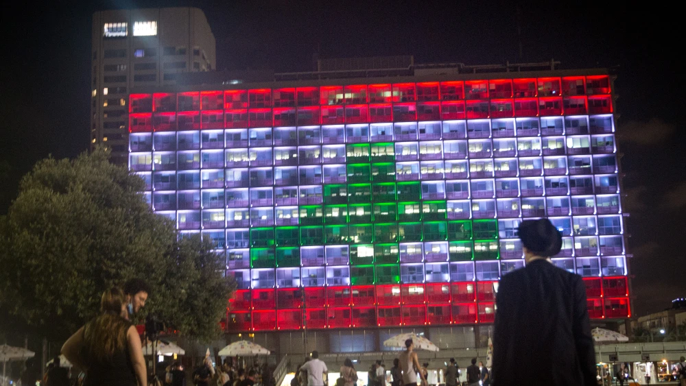 The Tel Aviv municipality on Rabin Square is lit up with the Lebanese flag on Aug. 5, in solidarity with the civilians killed in multiple explosions in Beirut the day before, on Aug. 5, 2020. Photo by Miriam Alster/Flash90.