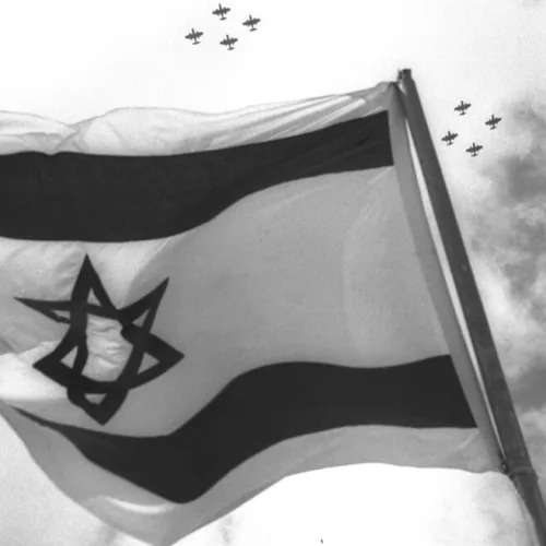 Israeli fighter jets fly over the nation's flag on Independence Day celebrations in 1957. Photo by Moshe Pridan/Government Press Office.
