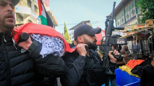 Palestinian gunmen and mourners participate in the funeral procession of 16-year-old Jana Zakarneh, killed the previous night during an IDF raid in Jenin, Dec. 12, 2022. Photo by Nasser Ishtayeh/Flash90.