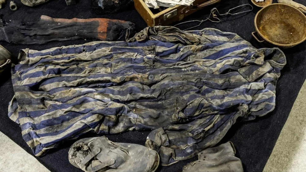 A prisoner's uniform is one of the items comprising a cache of finds from the Auschwitz former death camp in Poland, donated in January 2025. Photo courtesy of Ambassador Yacov Livne/the Foundation of Memory Sites Near Auschwitz-Birkenau.