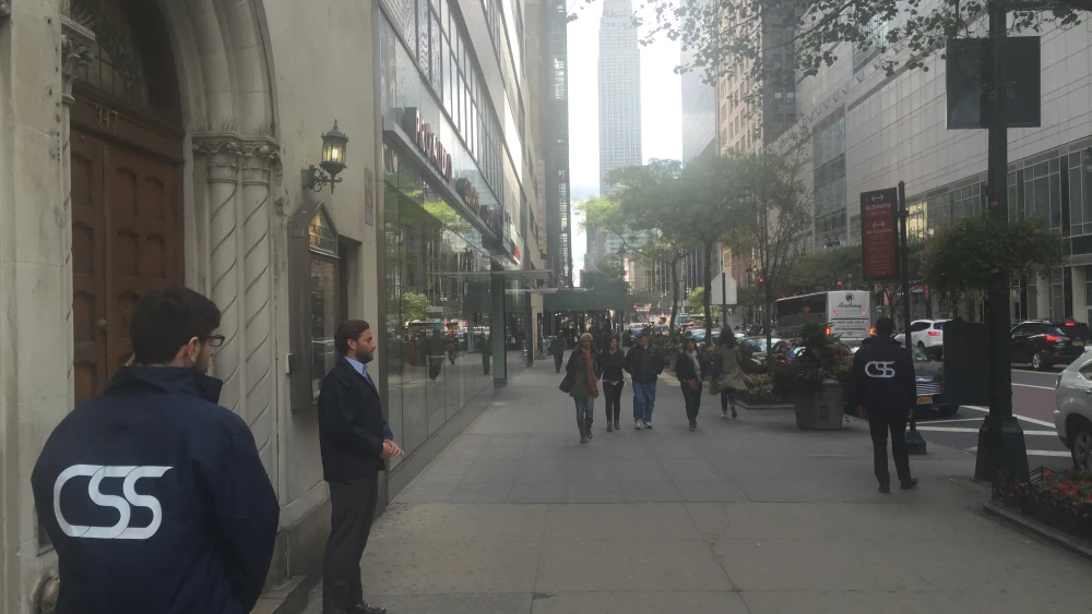 Community Security Service volunteers stand guard outside an urban synagogue. Credit: Community Security Service.