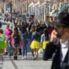 Costumed Israeli teenagers walk in the Jerusalem city center ahead of the Jewish holiday of Purim, on March 8, 2020. Photo by Olivier Fitoussi/Flash90.