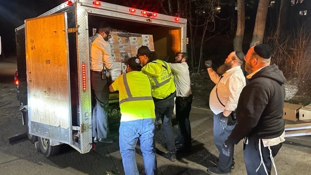 Acting on a rabbinic dispensation, members of Chaverim of Rockland in New York load up a truck with emergency supplies on the second night of Passover to ship to Jews in Montreal, hit by power outages amid an ice storm, April 6, 2023. Credit: Courtesy. (Photographer was not Jewish.)