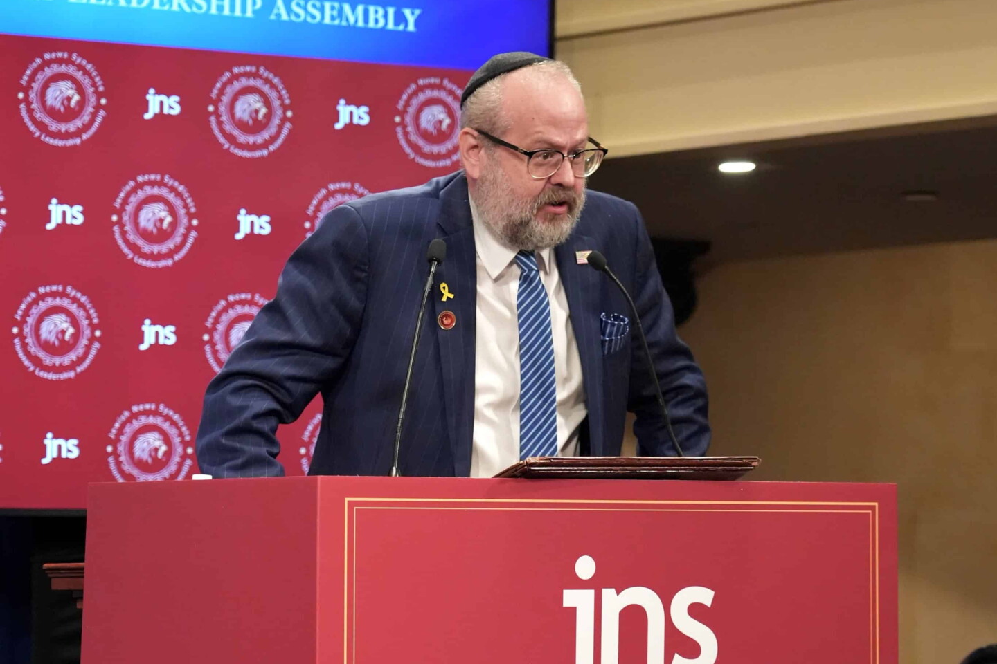 Rabbi Yehuda Kaploun speaks at the JNS Visionary Leadership Assembly in New York City on Sept. 28, 2025, sharing how Jewish identity guides his work as U.S. special envoy–designate to combat antisemitism. Credit: JNS.