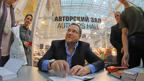 Alexander Ilichevsky signs books at a fair in Moscow. Credit: Vadim Brodsky.
