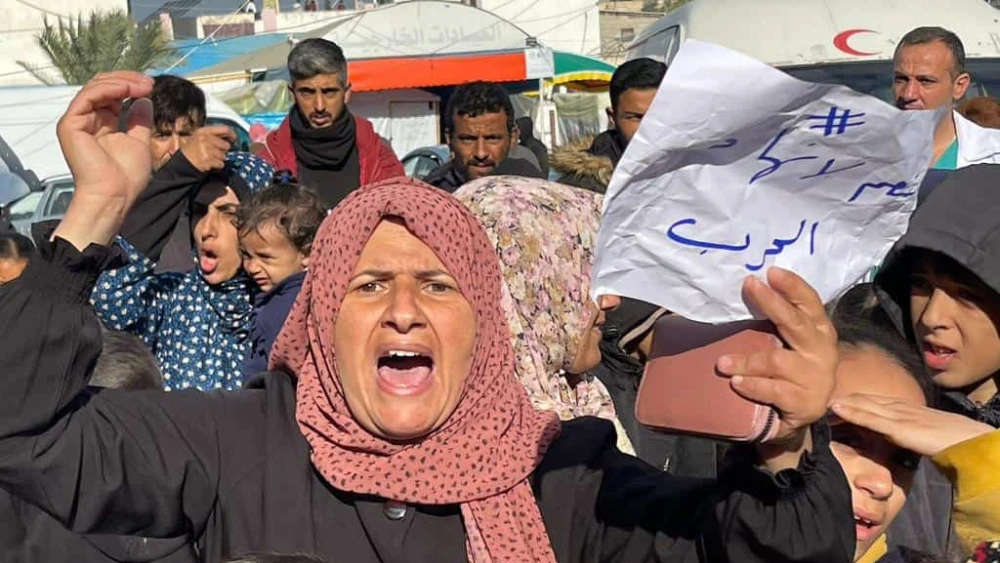 An anti-Hamas demonstration near the Al Aqsa hospital in Deir al-Balah in the central Gaza Strip, on Jan. 24, 2024. The signs read "We are fed up" and "Free the kidnapped." Photo by Majdi Fathi/TPS.