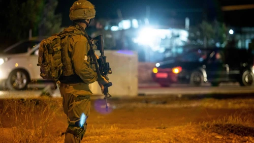 Israeli troops stand near the scene of a suspected car-ramming attack at the entrance to the village of Husan in Judea, June 23, 2018. Photo by Aharon Krohn/Flash90.
