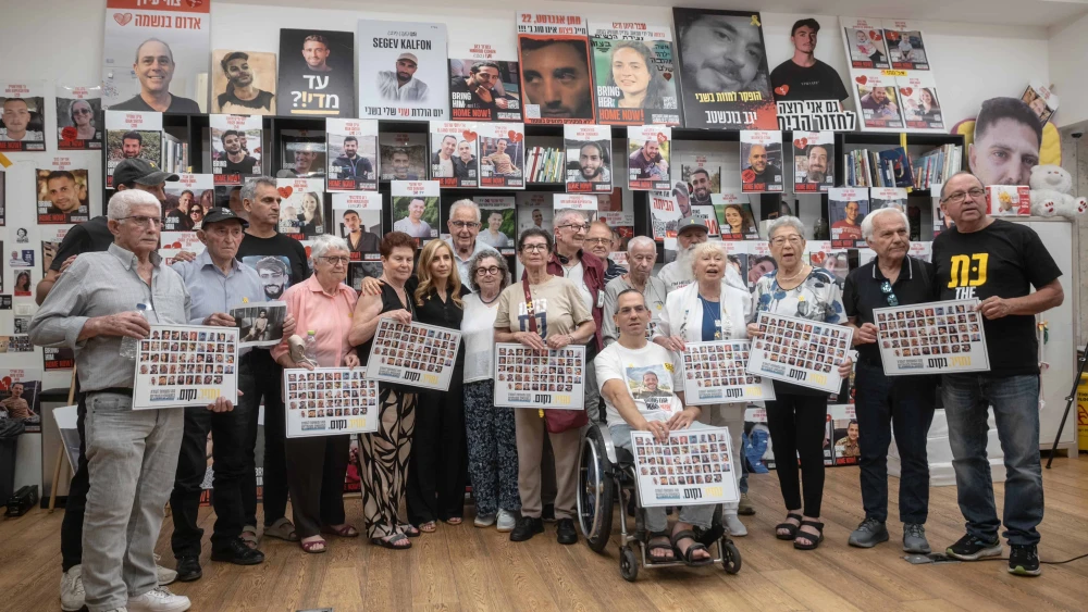 Holocaust survivors pose for a photograph after meeting released hostages families of hostages still being held in Gaza, in Tel Aviv on August 5, 2025. Photo by Chen Schimmel.