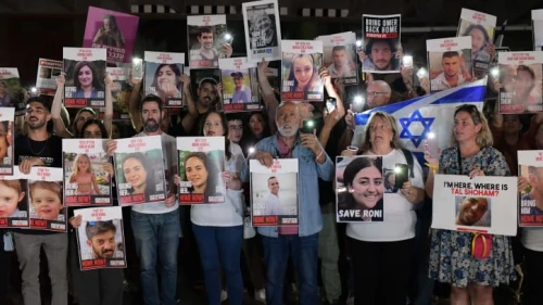 Families of those held hostage by Hamas terrorists in the Gaza Strip hold photos of their loved ones during a protest outside of the Tel Aviv Museum of Art on Oct. 21, 2023. Photo by Tomer Neuberg/Flash90.