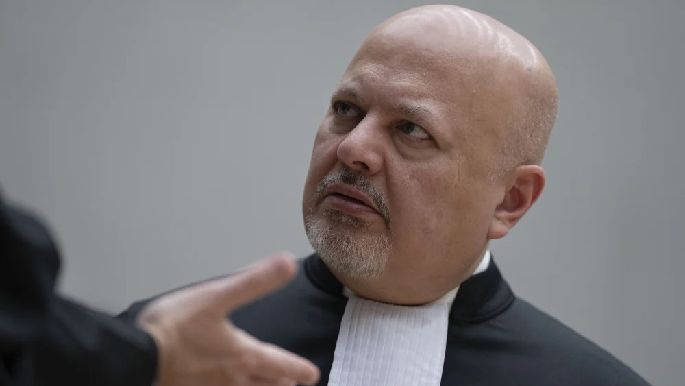 Chief Prosecutor Karim Khan talks prior to the first appearance of former Philippine President Rodrigo Duterte before the International Criminal Court (ICC) on charge of crimes against humanity over his deadly crackdown on narcotics, in The Hague on March 14, 2025. Photo by Peter Dejong/Pool/AFP via Getty Images.