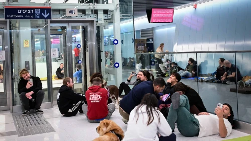 People take cover from incoming missiles fired from Iran at an undergoing train station in Tel Aviv, Feb. 28. 2026. Photo by Avshalom Sassoni/Flash90.